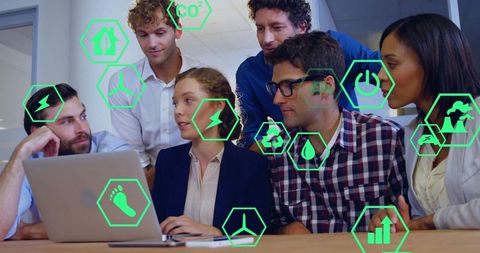 Collaborating team analyzing sustainability data with neon green energy icons overlay