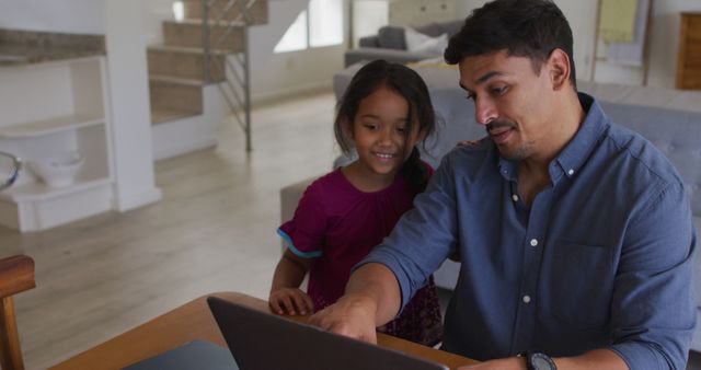 Father and Daughter Engaging with Laptop at Home - Download Free Stock Images Pikwizard.com