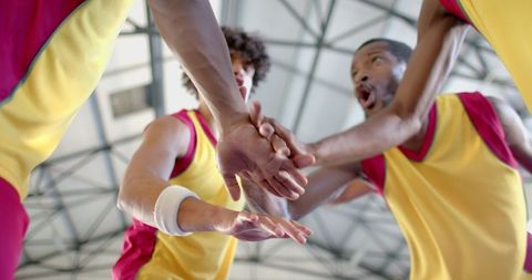 Diverse Basketball Team Showing Unity in Indoor Court