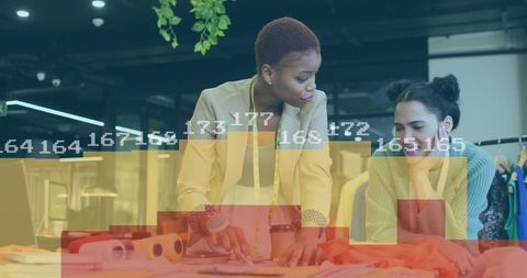 Fashion Designers Analyzing Data with Virtual Graphic Interface