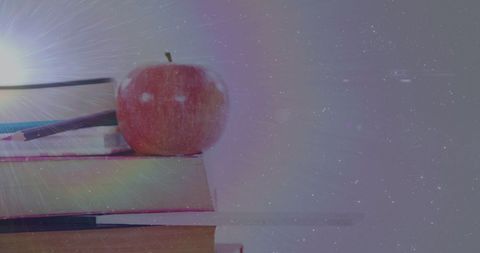 Apple on Books with Dreamy Light and Cosmic Background - Download Free Stock Images Pikwizard.com