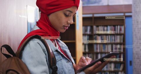 Student Engaging with AI Technology in Modern Library