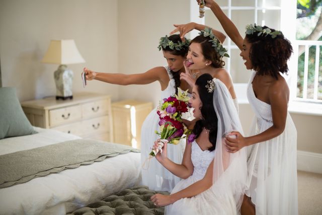 Bride and Bridesmaids Taking Selfie in Bedroom - Download Free Stock Photos Pikwizard.com