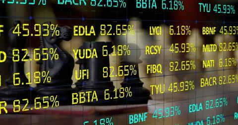 Chess pieces overlaying stock ticker displaying percentages and symbols for finance strategy