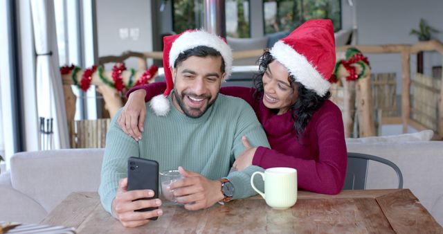 Couple Wearing Santa Hats Video Calling Christmas Morning - Download Free Stock Images Pikwizard.com