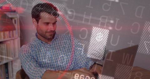 Professional working on laptop amidst digital overlay code in office