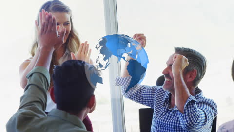 Diverse Team Celebrating Success with Virtual Globe Projection