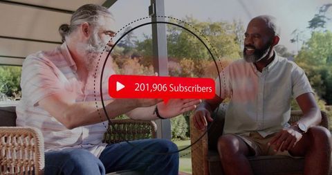 Two men shaking hands celebrating 201,906 subscribers while chatting on sunny patio