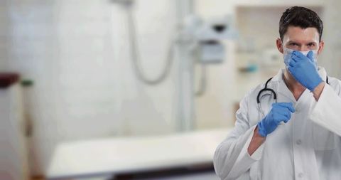 doctor adjusting mask in hospital environment for safety and hygiene - Download Free Stock Images Pikwizard.com