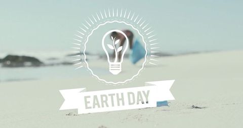 Earth day emblem on pastel beach with blurred figure promoting environmental awareness