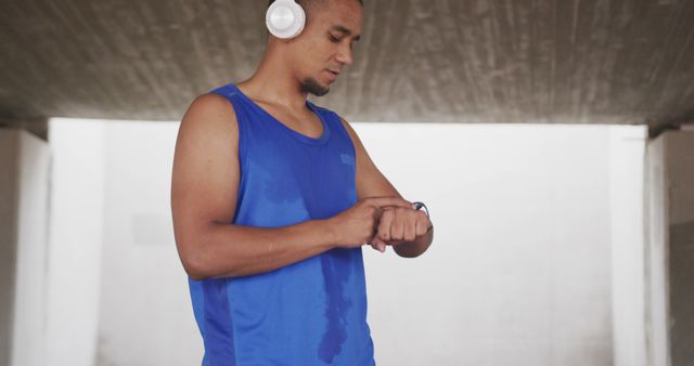 Man Checking Fitness Tracker While Exercising Outdoors - Download Free Stock Images Pikwizard.com