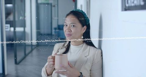 Asian Woman Holding Mug in Modern Office with Audio Overlay