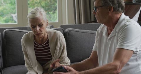 Senior Couple Engaging in Thoughtful Discussion at Home - Download Free Stock Images Pikwizard.com