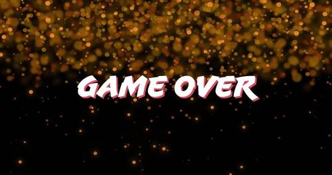 Game over text with golden bokeh lights on black background