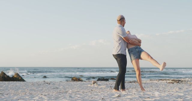 Happy Couple Enjoying Piggyback Ride on Beach During Sunset - Download Free Stock Images Pikwizard.com