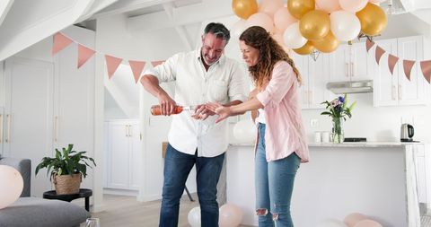 Couple Celebrating Engagement with Toast at Home