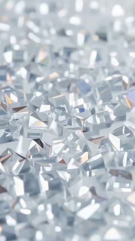 Vertical panning over sparkling crystal gemstones with prismatic reflections, geometric facets