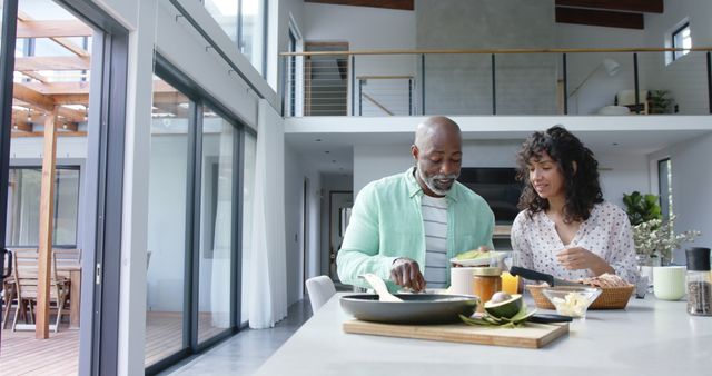 Smiling Couple Enjoying Breakfast in Modern Kitchen - Download Free Stock Images Pikwizard.com