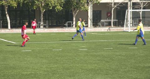 Amateur Soccer Match on Sunny Day Showcasing Team Skills
