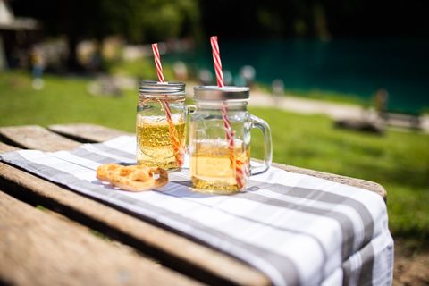 Summer refreshment with apple juice in mason jars outdoors