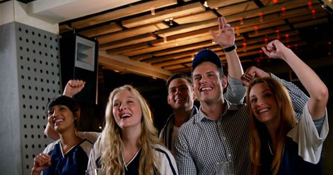 Friends Cheering Together in Sports Bar - Download Free Stock Images Pikwizard.com
