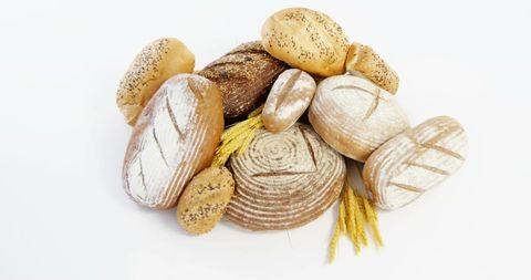 Freshly Baked Artisan Bread Assortment with Wheat Stalks - Download Free Stock Images Pikwizard.com