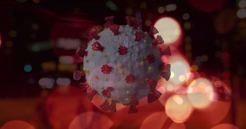 Spinning COVID-19 Cell Over Blurred City Night Lights