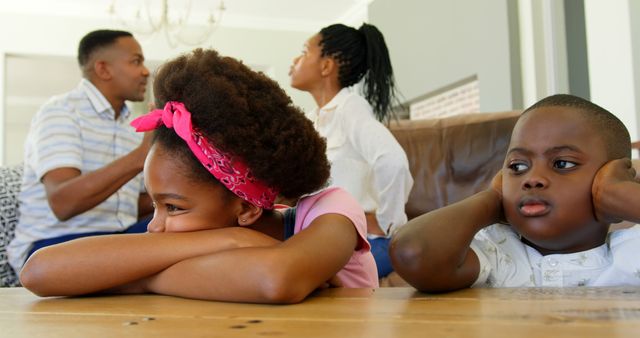 Children looking bored while parents arguing in background at home - Download Free Stock Images Pikwizard.com