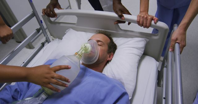 Diverse group of doctors in face masks pushing patient with oxygen mask in bed in hospital corridor - Download Free Stock Photos Pikwizard.com