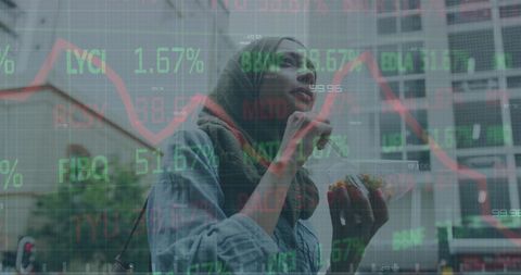 Woman Analyzing Financial Data on Smartphone in Urban Environment