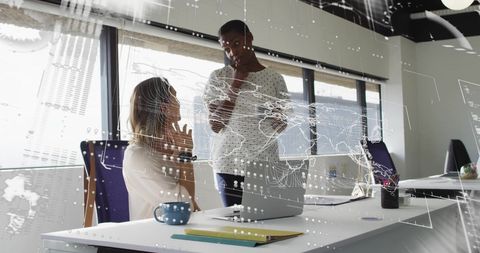 Diverse Colleagues Discussing Work with Digital Global Interface