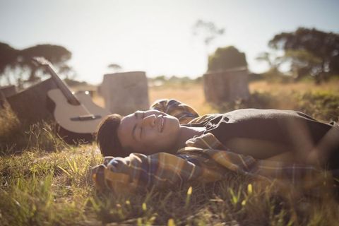 Man Enjoying Relaxing Afternoon in Rustic Field