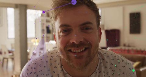 Bearded man with digital network overlay in modern apartment