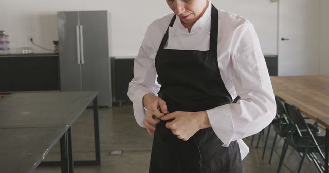 Professional Chef Preparing for Work in Kitchen - Download Free Stock Images Pikwizard.com