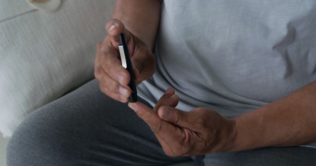 Close Up of Adult Checking Blood Sugar at Home, Diabetes Management - Download Free Stock Images Pikwizard.com