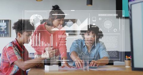 Diverse Colleagues Analyzing Data with Digital Dashboard