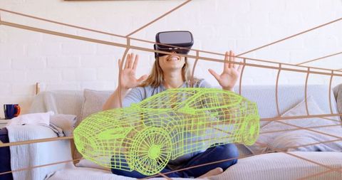 Woman with vr headset experiencing virtual car design at home