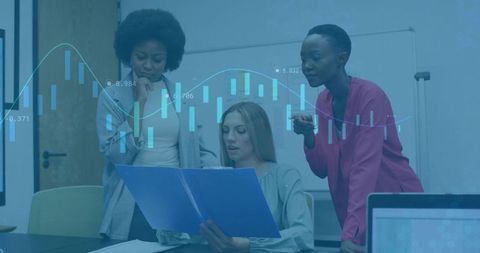 Professional Women Analyzing Business Data during Meeting