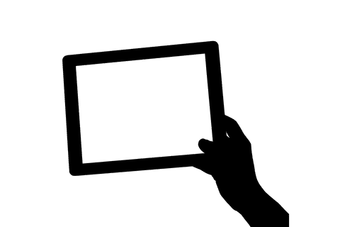 Black silhouette of hand holding tablet on transparent background