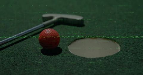 Red Golf Ball Near Hole with High-Tech Analytics Overlay