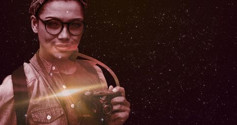 Smiling Woman Holding Vintage Camera with Starry Night Sky