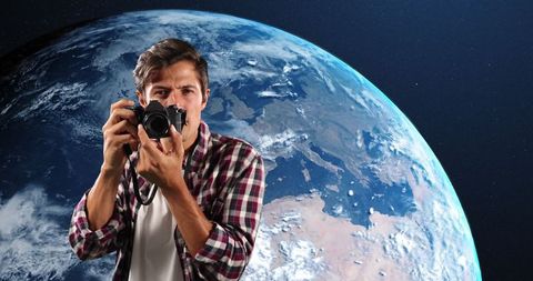 Photographer Capturing Moments in Front of Earth Globe
