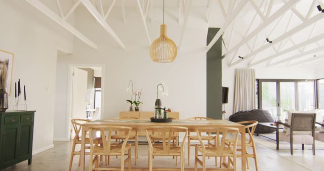 Modern dining room featuring wooden furniture and high ceilings, ideal for contemporary home design and interior decor inspiration. Perfect for use in articles about luxury home living or minimalist lifestyle blogs.