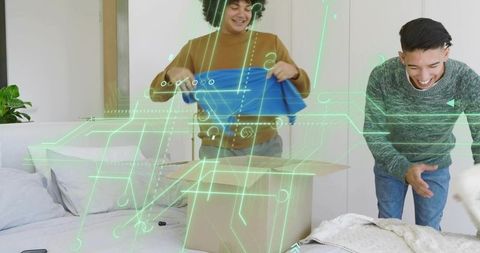 Roommates unpacking and organizing clothes with augmented reality hologram overlay