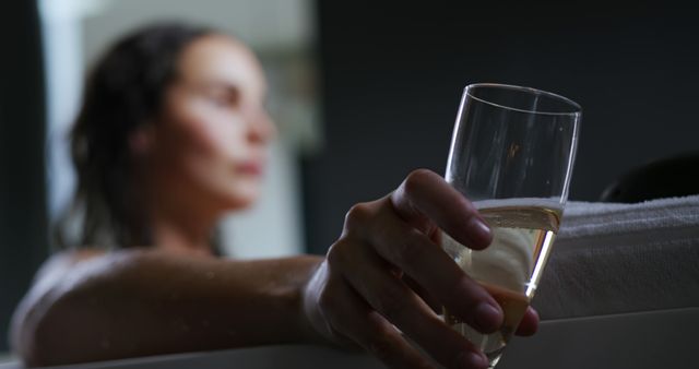 Relaxing Woman Holding Glass of Champagne in Bathtub - Download Free Stock Images Pikwizard.com