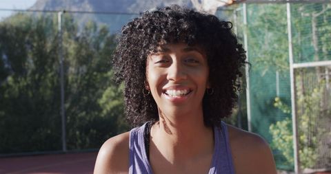 Confident African American Female Basketball Player Smiling Outdoors