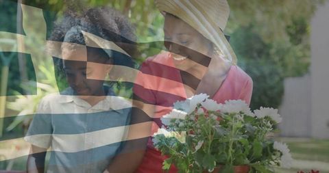 Mother and Daughter Bonding Over Gardening with Flowers