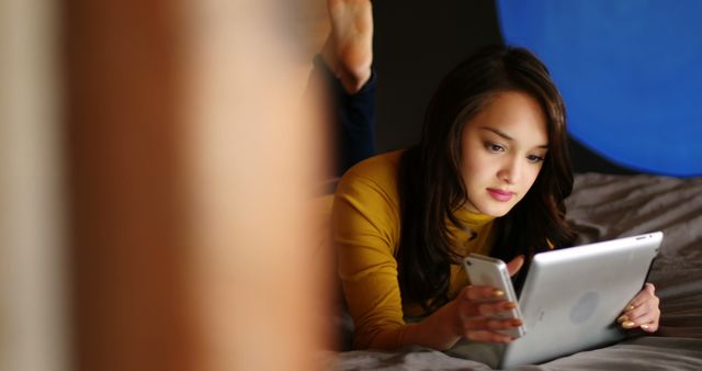 Young Woman Relaxing and Using Tablet at Home - Download Free Stock Images Pikwizard.com