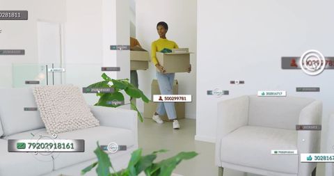 Woman carrying moving box in modern minimalist living room with digital overlay icons
