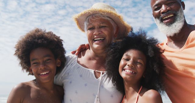 Happy Multi-Generational Family Bonding on Beach - Download Free Stock Images Pikwizard.com